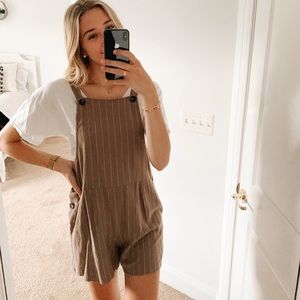 Tan linen overalls with thin white stripes